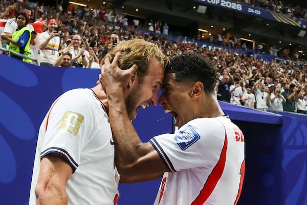 England's Harry Kane (left) and Jude Bellingham celebrate after Kane's goal against Congo. (Jason Getz/AJC)
