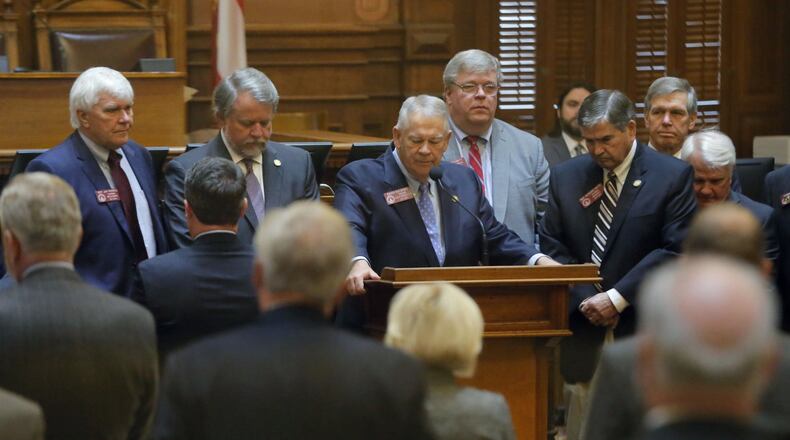 Georgia House Speaker David Ralston and House members take a moment before the start of business Tuesday to remember state Rep. John Meadows, R-Calhoun, who was the chairman of the House Rules Committee. Meadows died early Tuesday, the first day of the special session. BOB ANDRES / BANDRES@AJC.COM