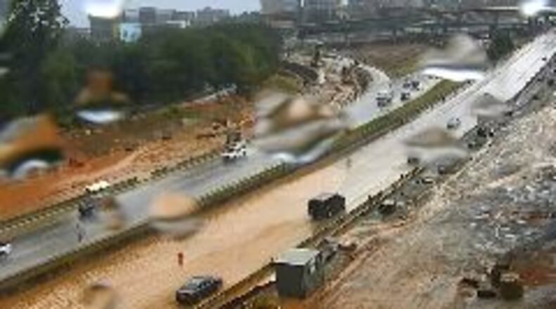 The southbound lanes of Ga. 400 were underwater Monday afternoon following heavy thunderstorms.