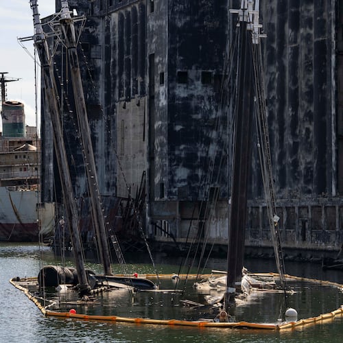 Debris of the Victory Chimes and the Pilot floats in the Henry Street Basin, Wednesday, Aug. 26, 2026, in the Brooklyn borough of New York. (AP Photo/Yuki Iwamura)