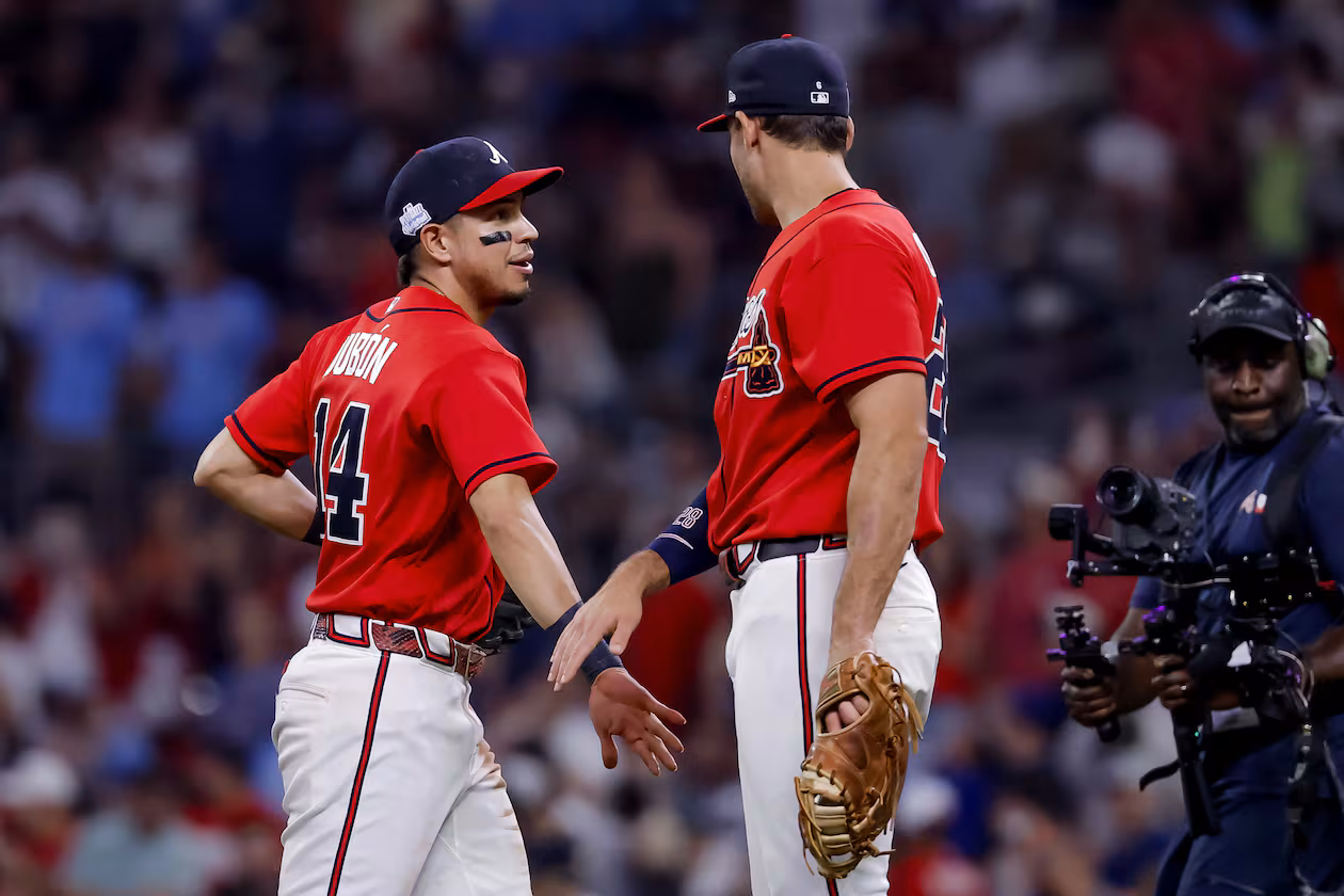 Atlanta Braves shortstop Mauricio Dubon, left, celebrates with third baseman Austin Riley, right, after their team defeated the Pittsburgh Pirates in a baseball game, Friday, June 5, 2026, in Atlanta. (AP Photo/Erik S. Lesser)