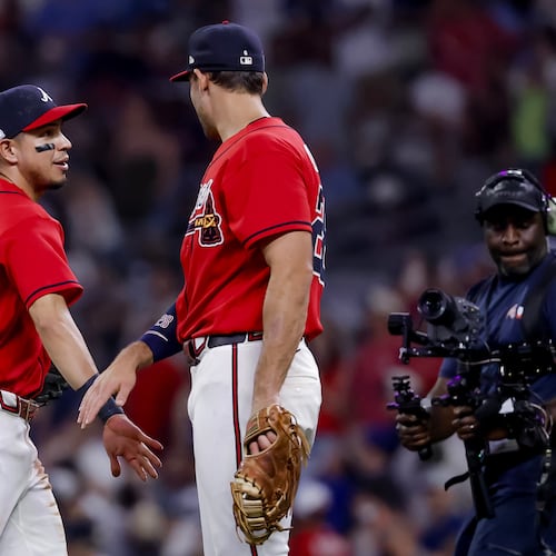 Atlanta Braves shortstop Mauricio Dubon, left, celebrates with third baseman Austin Riley, right, after their team defeated the Pittsburgh Pirates in a baseball game, Friday, June 5, 2026, in Atlanta. (AP Photo/Erik S. Lesser)