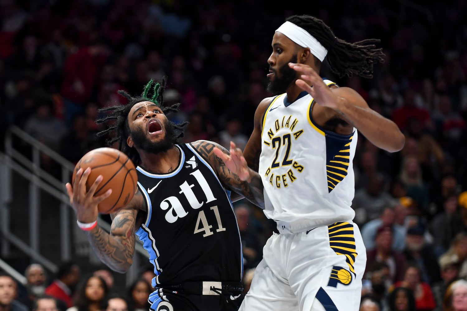 Atlanta Hawks forward Saddiq Bey (41) drives the baseline as Indiana Pacers forward Isaiah Jackson (22) defends during the second half of an NBA game Tuesday, November 21, 2023. (Daniel Varnado/For the AJC)