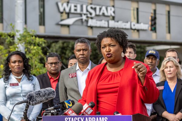 Stacey Abrams speaks at a news conference alongside health care providers outside the WellStar Atlanta Medical Center on Sept. 2, 2022. (Steve Schaefer/The Atlanta Journal-Constitution/TNS)