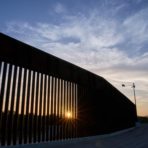 FILE - The sun sets over a section of the border wall, June 18, 2025, in Mission, Texas. (AP Photo/Jacquelyn Martin, File)