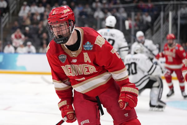 Denver's Aidan Thompson celebrates after scoring during the third period in a semifinal game in the NCAA Frozen Four men's college hockey tournament against Western Michigan, Thursday, April 10, 2025, in St. Louis (AP Photo/Jeff Roberson)