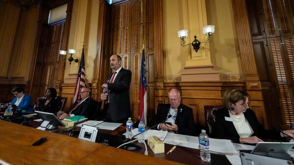 FILE - Georgia's State Election Board members discuss proposals for election rule changes at the state capitol, Sept. 20, 2024, in Atlanta. (AP Photo/Mike Stewart, file)