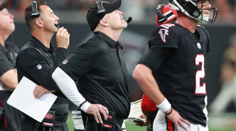 Falcons offensive coordinator Steve Sarkisian (from left), head coach Dan Quinn, and quarterback Matt Ryan can only watch from the sidelines in the fourth quarter falling to the Bengals 37-36 in a NFL football game on Sunday, Sept 30, 2018, in Atlanta.   Curtis Compton/ccompton@ajc.com