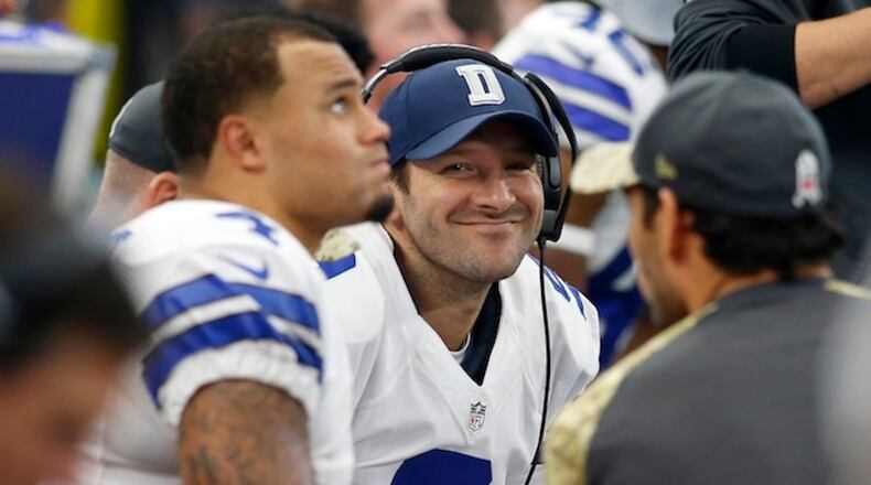 The Dallas Cowboys' Tony Romo (9) smiles as he talks with fellow quarterback Dak Prescott (4) on the bench against the Baltimore Ravens on November 20, 2016, at AT&T Stadium in Arlington, Texas. (Brad Loper/Fort Worth Star-Telegram/TNS)
