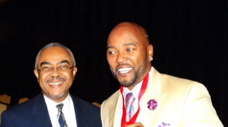 Ryan Cameron (right) is among the Atlanta radio personalities who are in the Georgia Radio Museum and Hall of Fame. RODNEY HO / RHO@AJC.COM