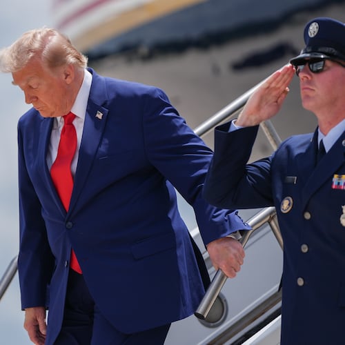 President Donald Trump arrives on Air Force One at Dobbins Air Reserve Base, Wednesday, July 22, 2026, in Marietta, Ga. (AP Photo/Julia Demaree Nikhinson)