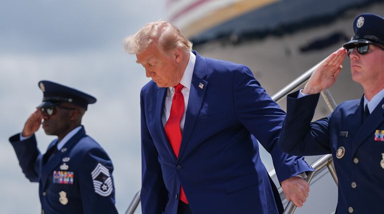 President Donald Trump arrives on Air Force One at Dobbins Air Reserve Base, Wednesday, July 22, 2026, in Marietta, Ga. (AP Photo/Julia Demaree Nikhinson)