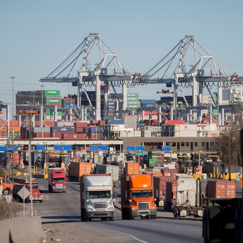 FILE- Tractor-trailers move cargo out of the Port of Savannah in Savannah, Ga., Jan. 30, 2018. (AP Photo/Stephen B. Morton, File)