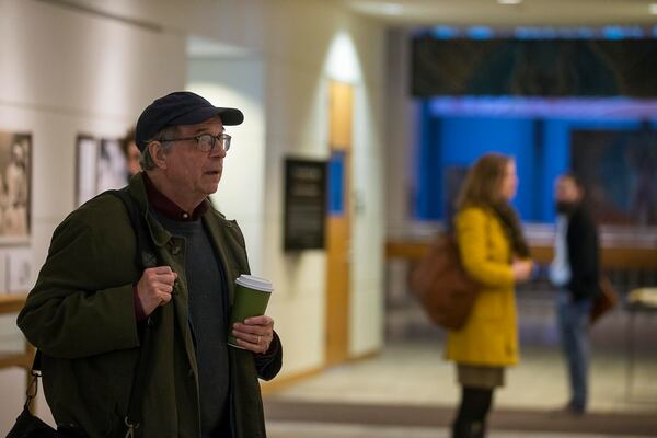 A man stops to look at the ‘Framing Shadows’ exhibit at the Robert W. Woodruff Library on the Emory campus. Barbara Krauthammer, co-author of “Envisioning Emancipation: Black Americans and the End of Slavery,” says that how viewers respond to the photos may depend on their personal history and relationship to domestic workers as much as their race.