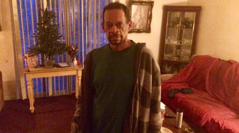 “The difficulty of finding a place you can afford is traumatic,” said Joseph Pugh, pictured in the living room of his Atlanta apartment. Photo by Bill Torpy