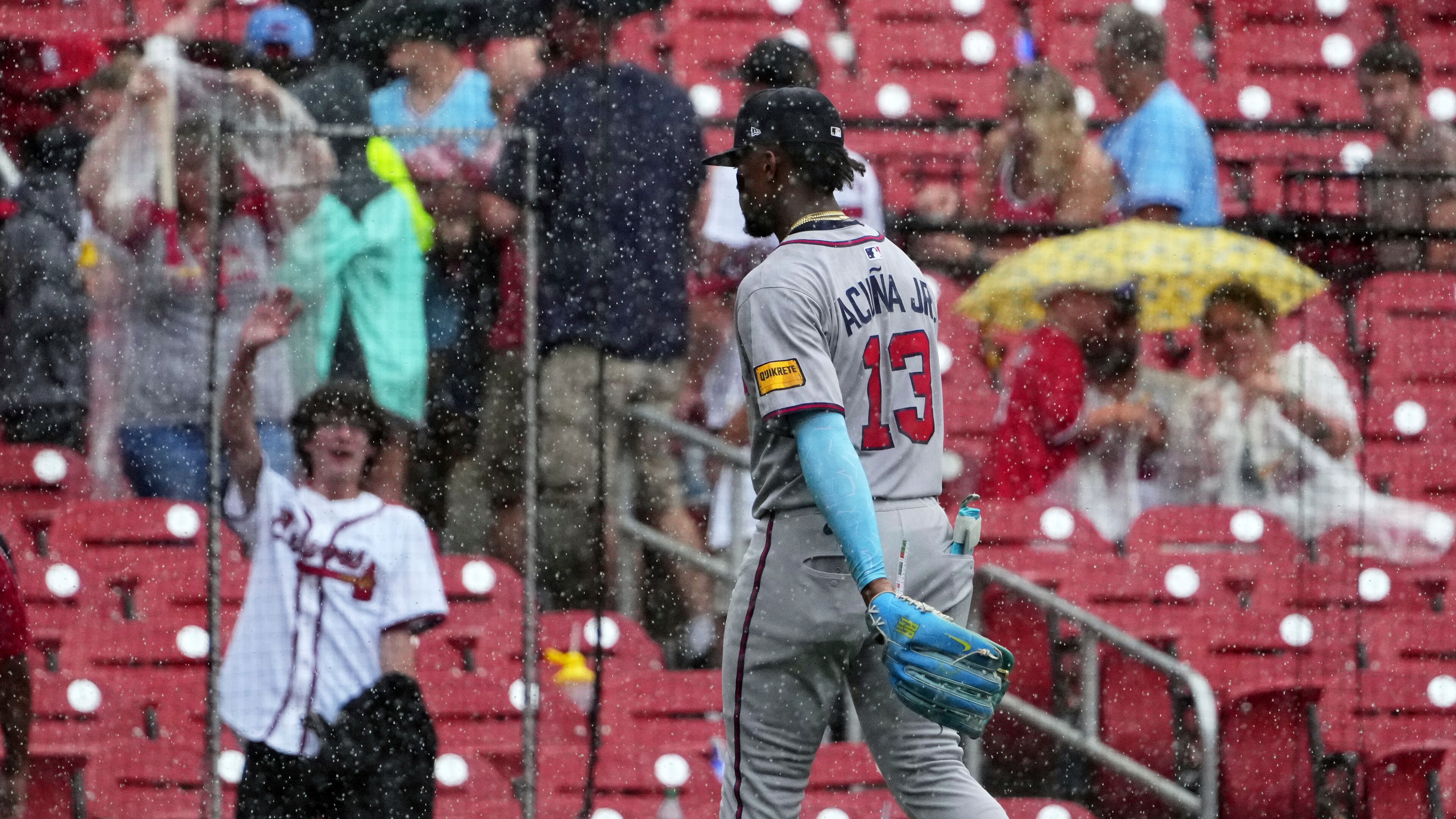 Atlanta Braves' Ronald Acuna Jr. walks off the field at the start of a rain delay in the third inning of a baseball game against the St. Louis Cardinals Sunday, July 13, 2025, in St. Louis. (AP Photo/Jeff Roberson)