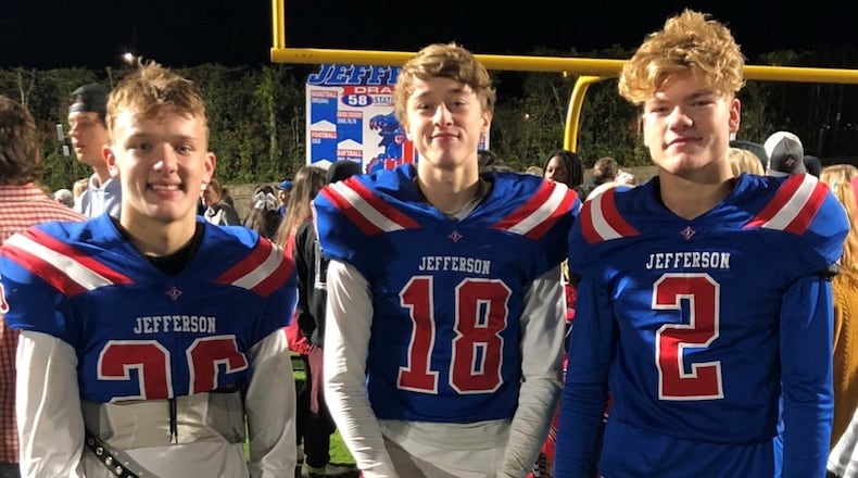 Bowman Horn (left), Max Aldridge (center) and Elijah DeWitt (right) pose for a photo after a Jefferson High School football game during their freshman year. (Photo courtesy of Bowman Horn)