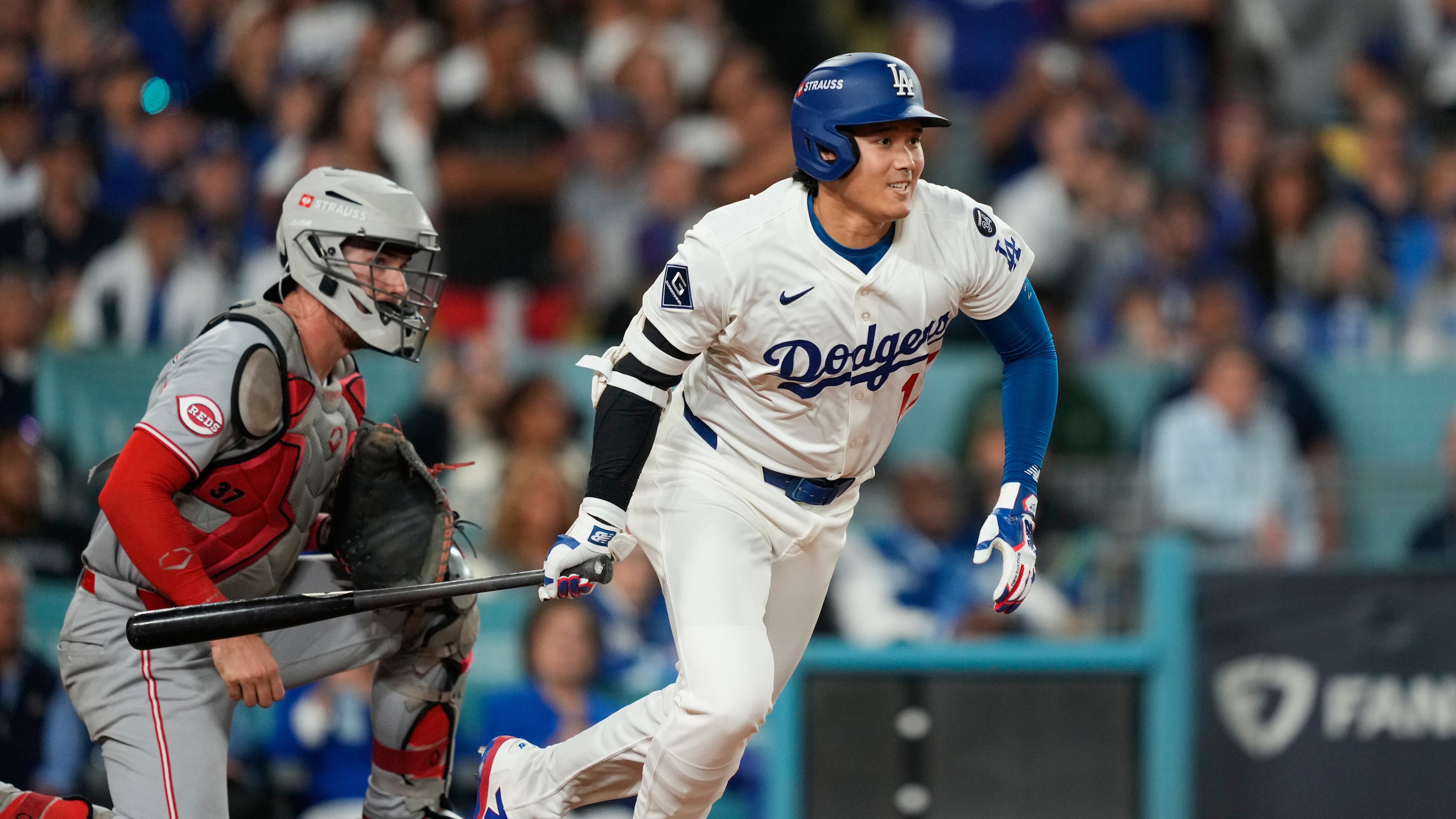 Los Angeles Dodgers' Shohei Ohtani follows through on an RBI single during the sixth inning in Game 2 of the National League Wild Card baseball playoff series against the Cincinnati Reds, Wednesday, Oct. 1, 2025, in Los Angeles. (AP Photo/Mark J. Terrill)