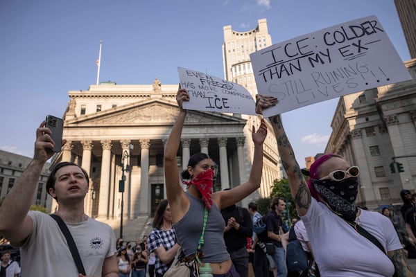 Demonstrators hold signs and chant during a protest against deportation by Immigration and Customs Enforcement in New York, Wednesday, June 11, 2025. (AP Photo/Yuki Iwamura)