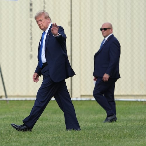 President Donald Trump walks to board his presidential limousine after arriving on Marine One from the Ellipse near the White House, Friday, Aug. 28, 2026, in Washington, on return from Houston. (AP Photo/Jacquelyn Martin)