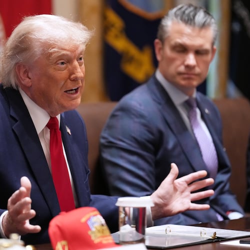 President Donald Trump speaks during a Cabinet meeting at the White House, Wednesday, May 27, 2026, in Washington, as Secretary of Defense Pete Hegseth, looks on. (AP Photo/Jacquelyn Martin)