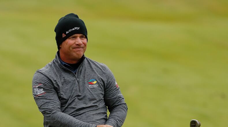 All warm and cozy, Scott McCarron enjoys a shot on No. 18 at TPC Sugarloaf Saturday. (Photo by Kevin C. Cox/Getty Images)