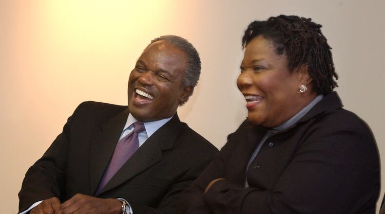 David Scott (left) laughs with his wife Alfredia as she tells of how he courted her with poetry when they were both in college. They married in 1969 and remained together until his death. (Jean Shifrin/AJC 2002)