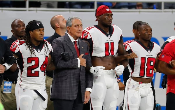 Atlanta Falcons owner Arthur Blank stands with his players during the national anthem before an NFL football game against the Detroit Lions, on Sunday, Sept. 24, 2017, in Detroit. (Rick Osentoski/AP 2017)