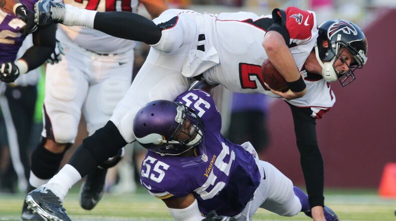 Minnesota Vikings outside linebacker Anthony Barr (55) tackles Atlanta Falcons quarterback Matt Ryan during the second half of an NFL football game, Sunday, Sept. 28, 2014, in Minneapolis. (AP Photo/Jim Mone)
