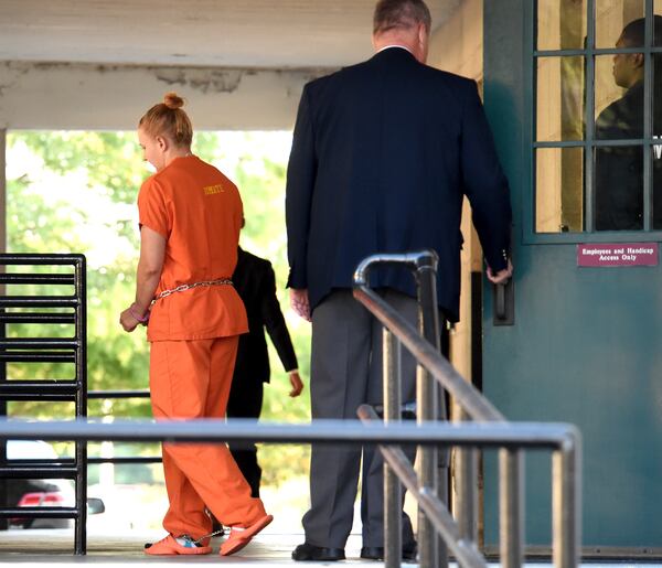 Accused leaker Reality Winner leaves the U.S. District Courthouse in Augusta, Ga., following a bond hearing Thursday afternoon June 8, 2017.  U.S. Magistrate Judge Brian Epps denied bond Thursday for 25-year-old Reality Winner. Prosecutor Jennifer Solari says investigators seized a notebook from Winner's house in Augusta, Georgia, and in it, Winner made references about traveling to the Middle East (Michael Holahan/The Augusta Chronicle via AP)