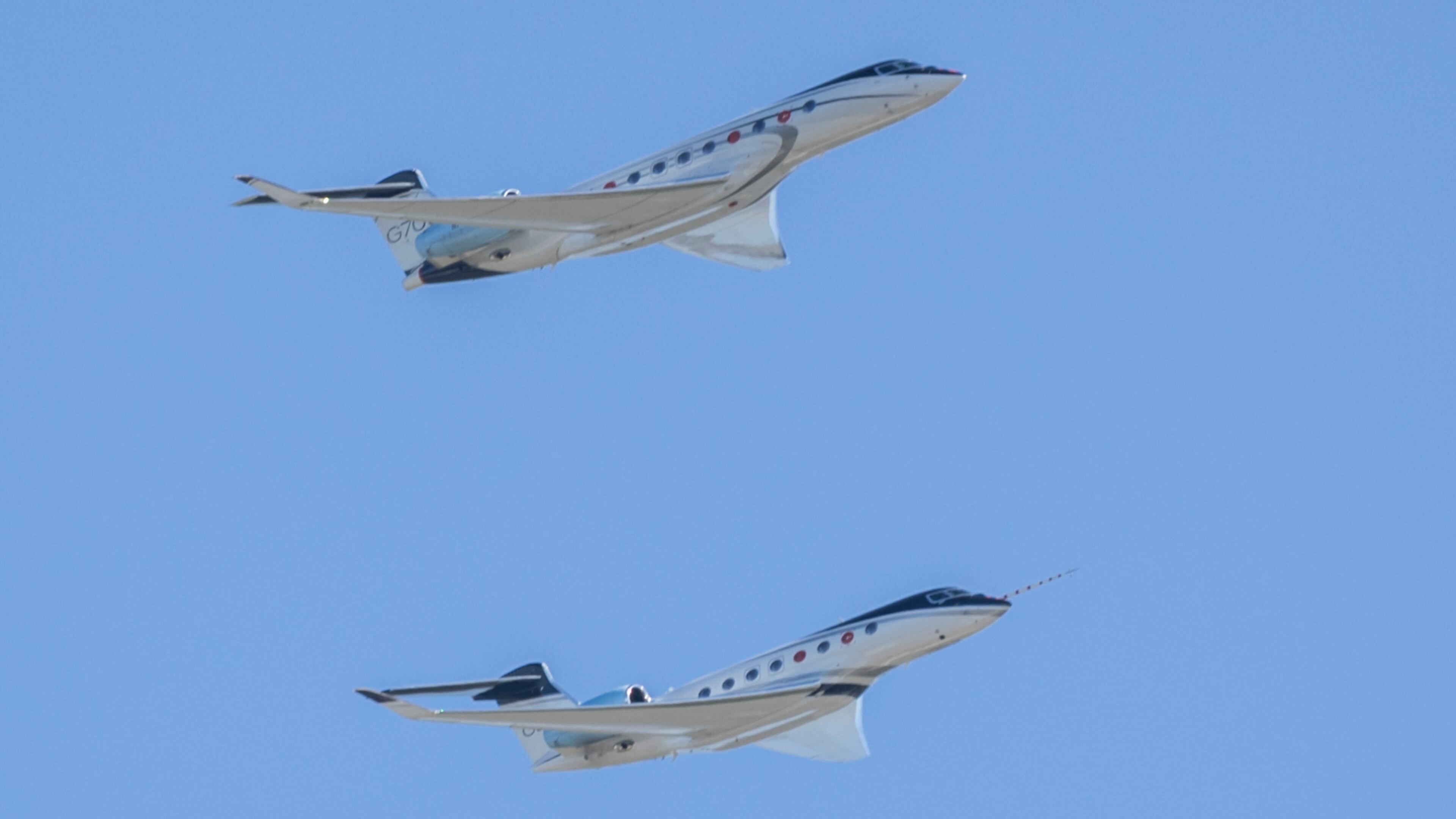 The G700 (top) and G800 perform a flyover during an event to celebrate the newly certified Gulfstream Aerospace Corporation G700. Aerospace is Georgia's second-largest industry, and the No. 1 sector for exports, including Gulfstream jets. (Stephen B. Morton/AJC 2024)