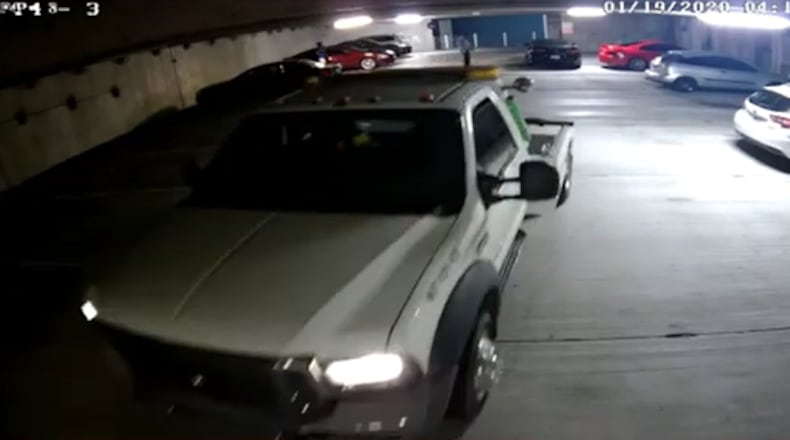 This is a screenshot of surveillance video from the night a group of thieves used a tow truck to steal a Chevrolet Camaro in northeast Atlanta.