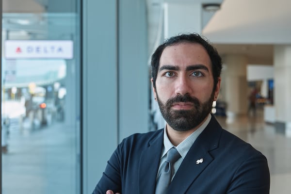 Aryasp Nejat, a former Delta Air Lines flight attendant, says he was fired after reporting sexual harassment and supporting unionization efforts. (Felix Uribe Jr. for the AJC)