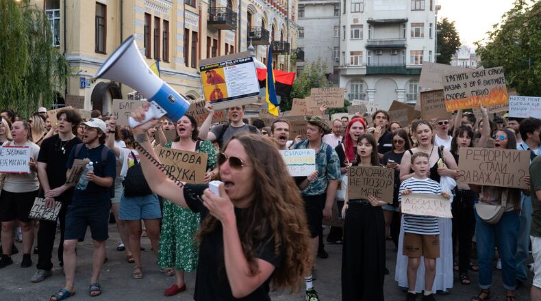 People gather to denounce President Volodymyr Zelenskyy's decision to dismiss Defense Minister Mykhailo Fedorov after six months in the post, Thursday, July 16, 2026, Kyiv, Ukraine. (AP Photo/Danylo Antoniuk)