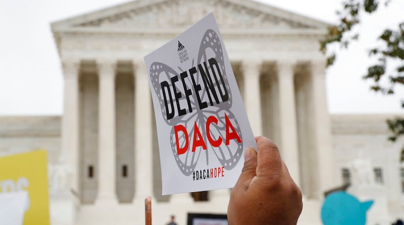 FILE - In this Nov. 12, 2019, file photo people rally outside the Supreme Court as oral arguments are heard in the case of President Trump's decision to end the Obama-era, Deferred Action for Childhood Arrivals program (DACA), at the Supreme Court in Washington. DACA recipients are assuming a prominent role in the presidential campaign, working to get others to vote, even though they cannot cast ballots themselves, and becoming leaders in the Democratic campaigns of Bernie Sanders and Tom Steyer as well as get-out-the-vote organizations. (AP Photo/Jacquelyn Martin, File)