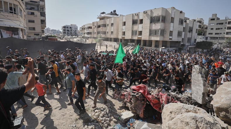 Palestinians carry the body of Ahmad Al-Batsh, a Qassam Brigades commander in Jabaliya, the military wing of Hamas, during his funeral after he was killed in an Israeli airstrike, in Gaza City, Tuesday, Sept. 15, 2026. (AP Photo/Yousef Al Zanoun)