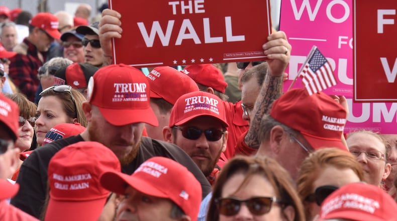 Voters in Macon await the arrival of President Donald Trump as he stumps for Republican gubernatorial nominee Brian Kemp. Hyosub Shin/hyosub.shin@ajc.com
