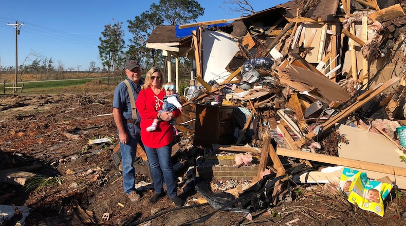 Hurricane Michael survivors in Colquitt, Ga. John Edward Wells with wife Marianne Wells and their granddaughter Maddie. (Joshua Sharpe/joshua.sharpe@ajc.com)
