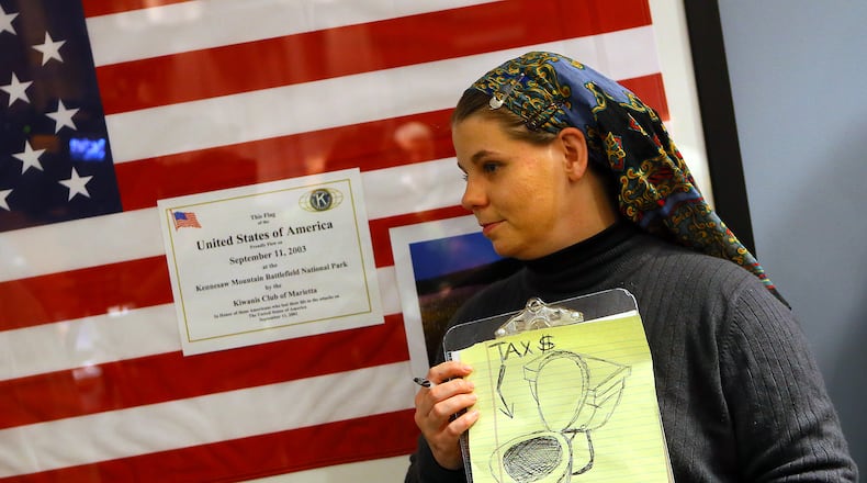 Amy Barnes, seen in this 2013 file photo, said Cobb County violated her First Amendment rights. CURTIS COMPTON / CCOMPTON@AJC.COM