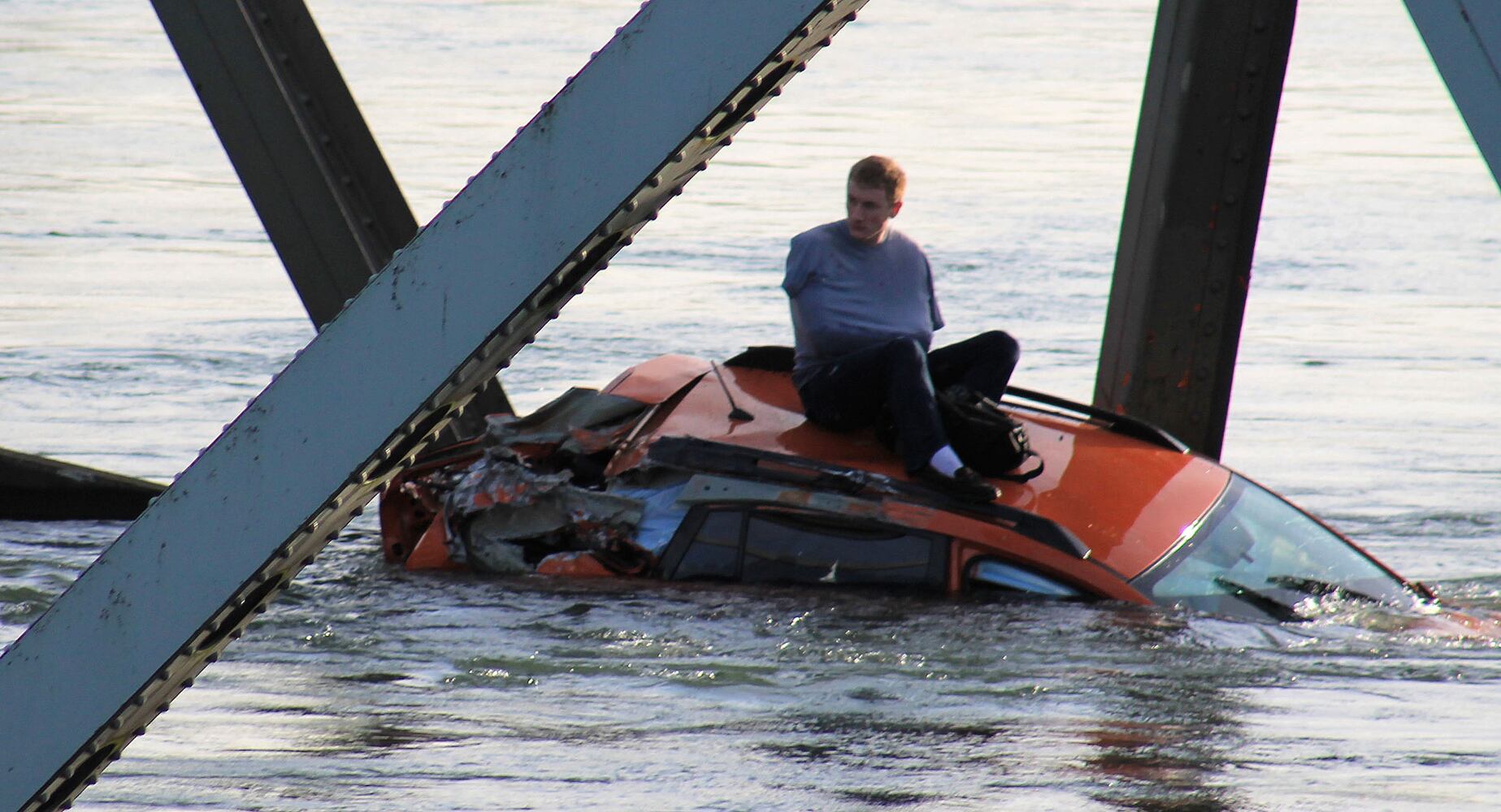 Vehicles, people dumped into water