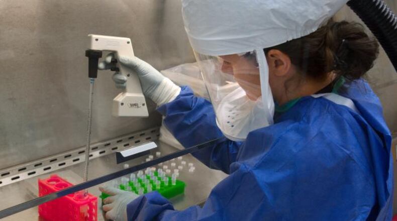 A CDC laboratory scientist works in one the agency's biocontainment labs. (Centers for Disease Control and Prevention)