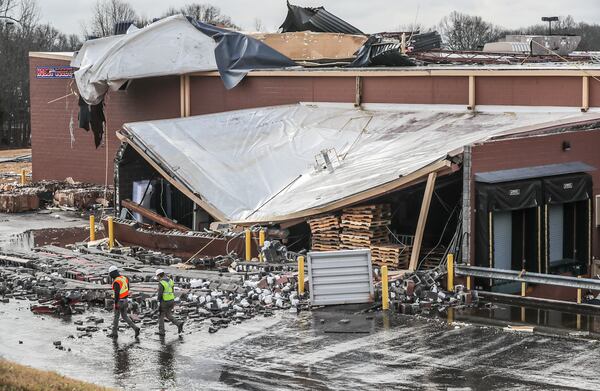 Assessment and cleanup begin Friday, Jan. 13, 2022, after strong storms left areas of damage across Georgia. (John Spink / John.Spink@ajc.com)