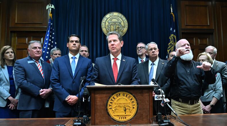 March12, 2020 Atlanta - Gov. Brian Kemp speaks as other officials standing behind during a press conference to provide an update on the state's efforts regarding COVID-19, after reporting the first death in Georgia related to coronavirus, at the Georgia State Capitol on Thursday, March 11, 2020. (Hyosub Shin / Hyosub.Shin@ajc.com)