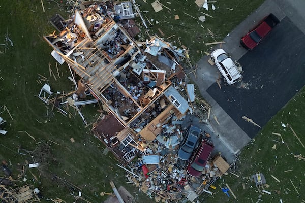 A home is destroyed after a severe storm passed through the area, Saturday, May 17, 2025, in London, Ky. (AP Photo/Carolyn Kaster)