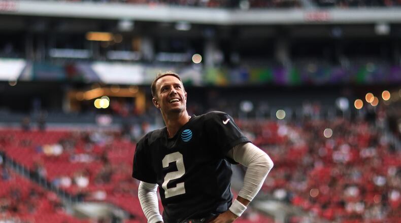 Quarterback Matt Ryan (2) looks up at fans during open practice at Mercedes-Benz Stadium, Sunday, July 29, 2018, in Atlanta.