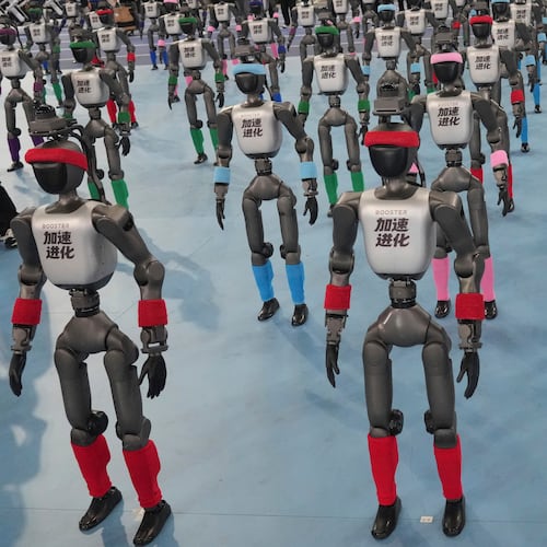 Robots are prepared ahead the opening ceremony of the World Humanoid Robot Games in Beijing, Saturday, Aug. 22, 2026. (AP Photo/Achmad Ibrahim)