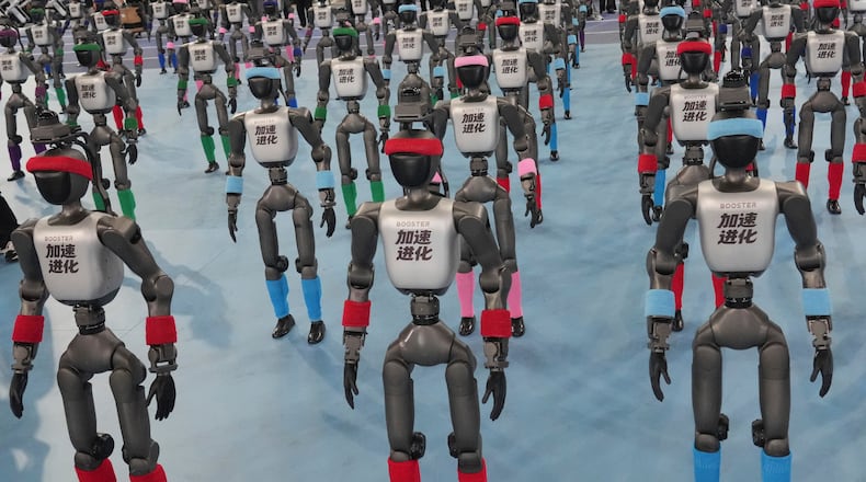 Robots are prepared ahead the opening ceremony of the World Humanoid Robot Games in Beijing, Saturday, Aug. 22, 2026. (AP Photo/Achmad Ibrahim)