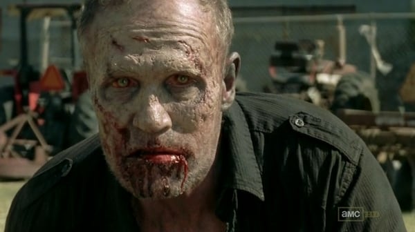 Merle Dixon tries to make up for his mucho bad behavior by trying (and failing) to kill the Governor. The Governor shoots him in the chest so he becomes a walker. CREDIT: AMC