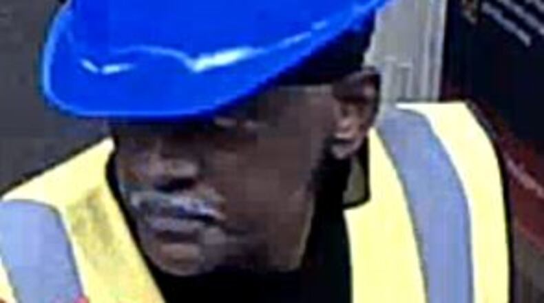 Surveillance footage captured this man allegedly robbing a Wells Fargo bank in Norcross on Tues., May 31, 2016. (Credit: Gwinnett County Police)