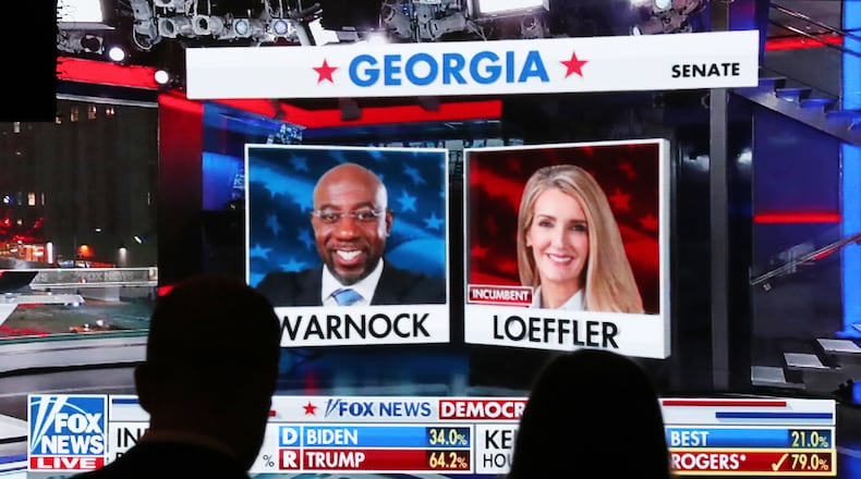 Republican supporters on Tuesday watch returns for Democratic U.S. Senate candidate Raphael Warnock and Republican incumbent Kelly Loeffler, who are headed for a Jan. 5 runoff. Curtis Compton / Curtis.Compton@ajc.com”